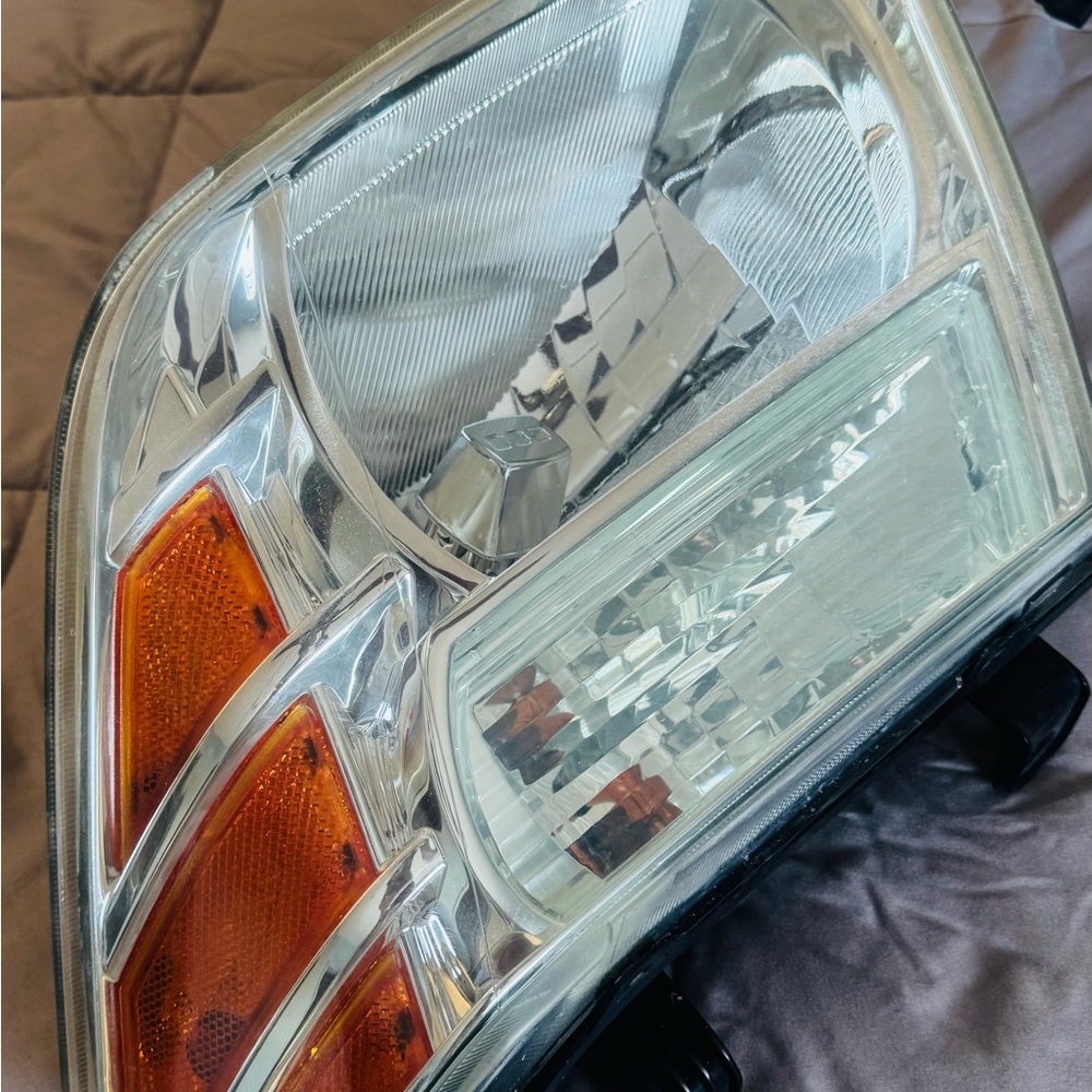 Car Headlight with Orange and Silver Accents